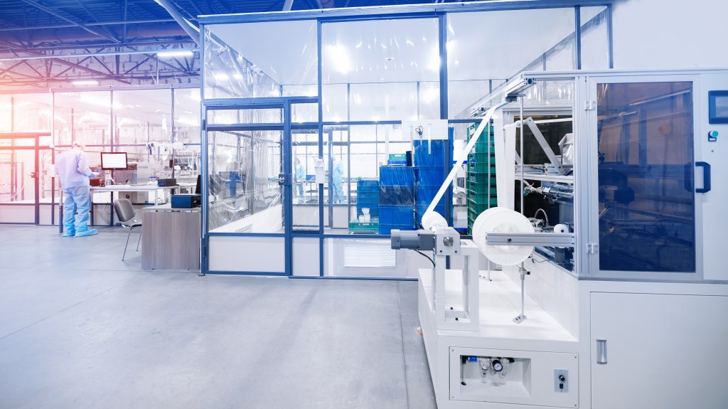 Medical device manufacturing equipment in a controlled production environment.